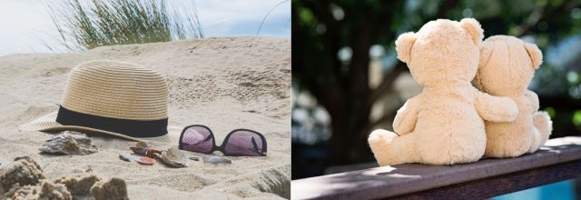 Hattu ja aurinkolasit hiekassa. Nallekarhut halaavat toisiaan.